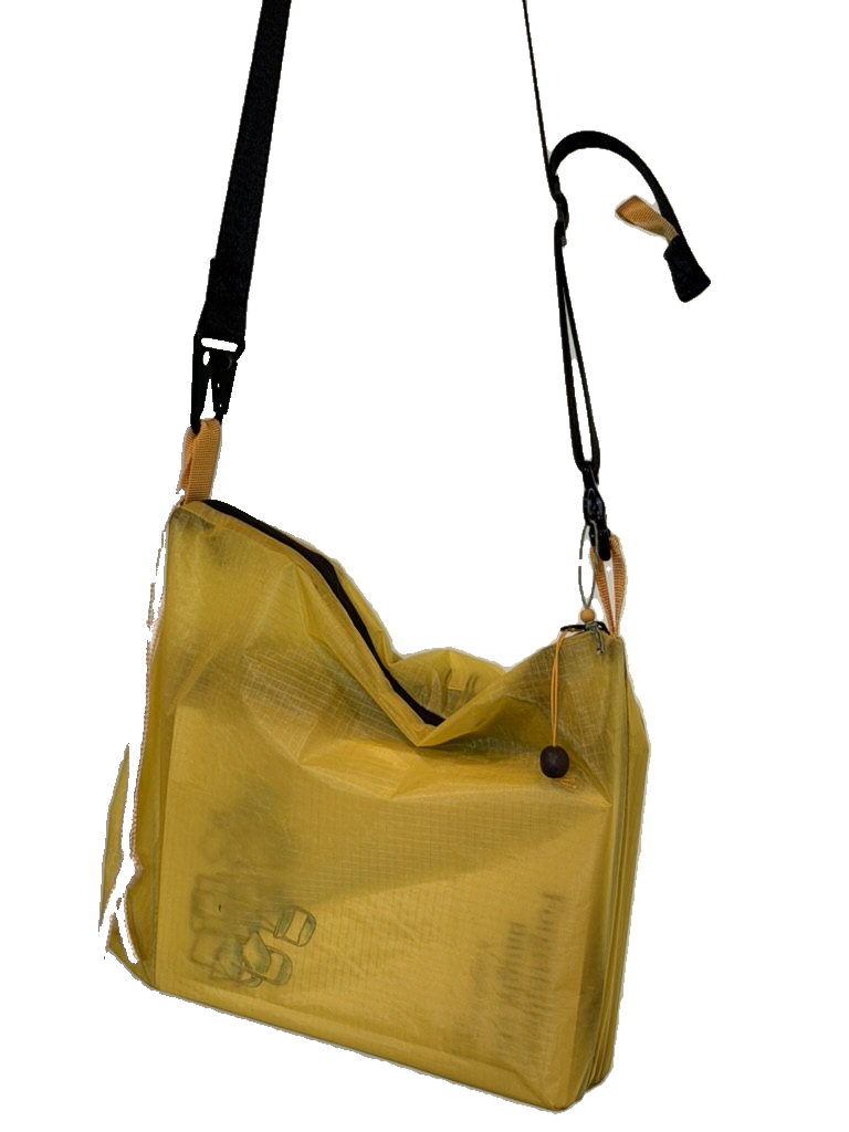 yellow lamina book bag with black nylon webbing strap