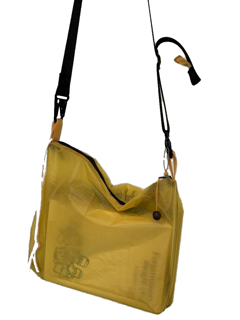 yellow lamina book bag with black nylon webbing strap